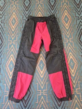 The North Face Black and Red Rage Rain Pants.